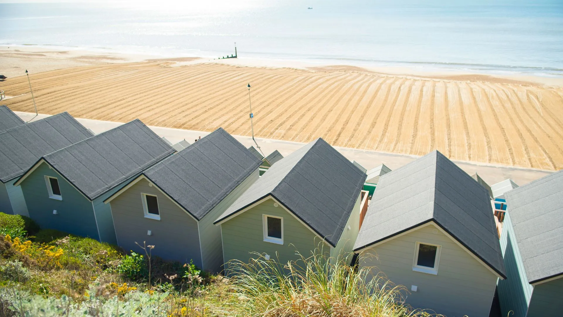 Ariel view of Beach Lodges overlooking clean, golden sand and sparkling sea